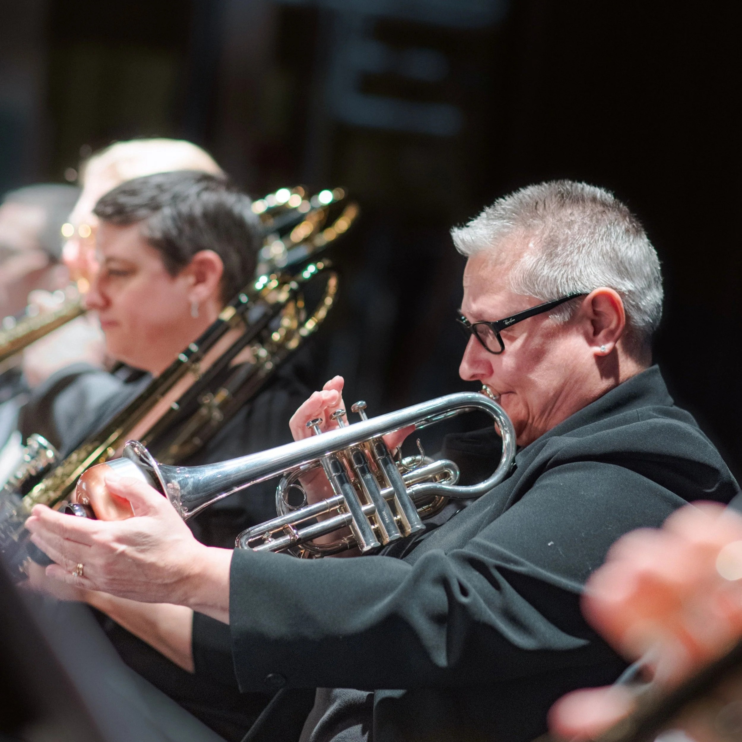 Trumpet player performing with the orchestra